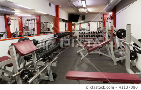 Weight training equipment in gym club 41137080
