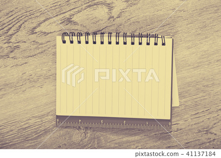 Notebook in line on table Notebook in line on table 41137184