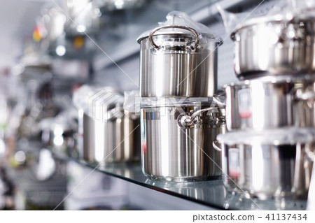 Image of shelfs with dishes in the kitchen department in the store. 41137434