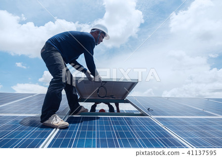 engineer team working on replacement solar panel 41137595