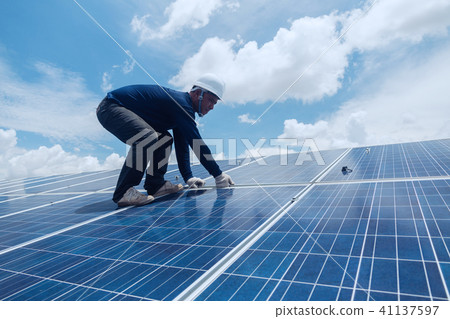 engineer team working on replacement solar panel engineer team working on replacement solar panel 41137597