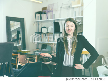 Woman seller inviting to chair chop 41137836