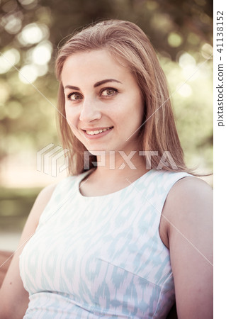 portrait of cheerful young woman portrait in outdoor 41138152