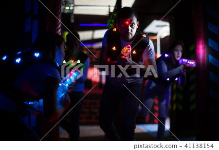 Excited guy during lasertag game 41138154