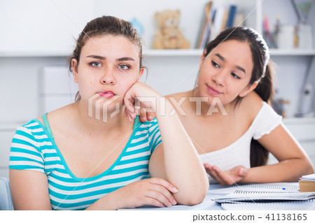 Girl trying to apologize to friend Girl trying to apologize to friend 41138165