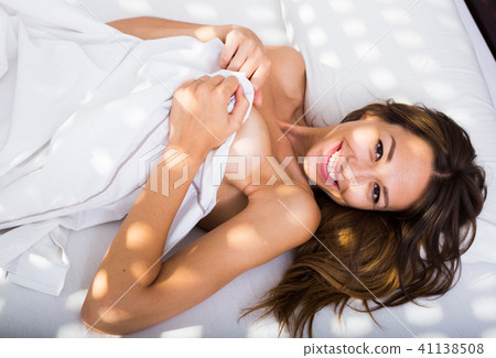 lying with sheet naked 41138508
