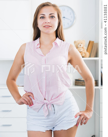 Smiling girl standing at home 41138881