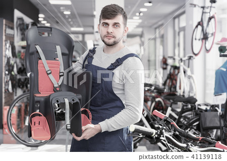 male demonstrating bicycle sit for child 41139118