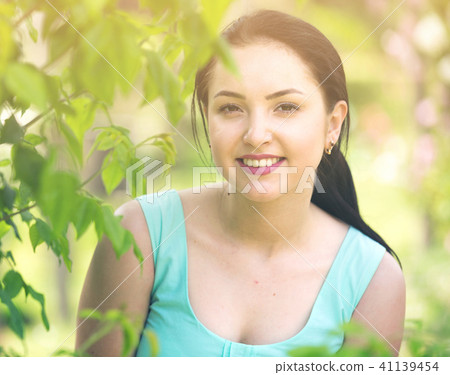 spring positive cheerful young female portrait in garden spring positive cheerful young female portrait in garden 41139454