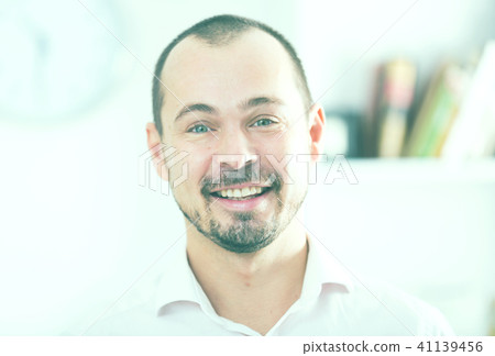 Positive young man in office Positive young man in office 41139456