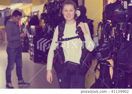 Girl is standing in diving vest Girl is standing in diving vest 41139902