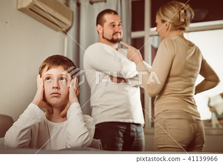 Sad boy during parents quarrel Sad boy during parents quarrel 41139966