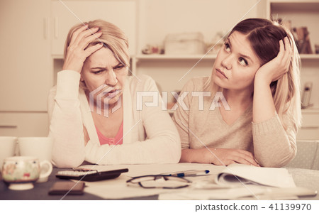 mother and her adult daughter with financial problems mother and her adult daughter with financial problems 41139970