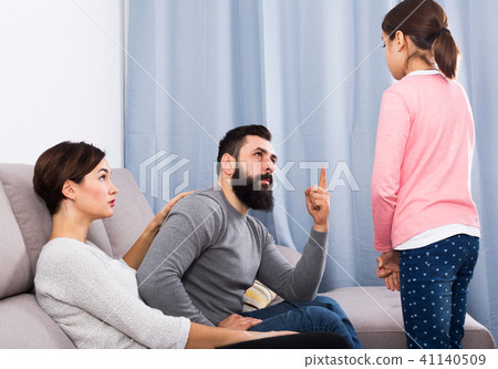 Parents lecturing their daughter 41140509