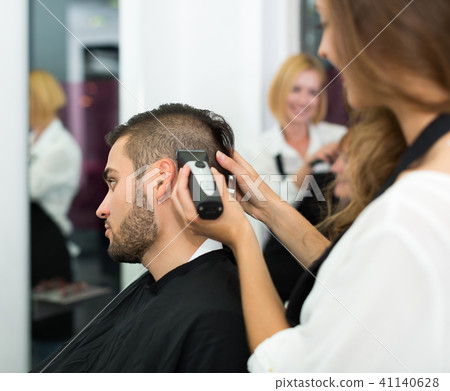 Young man at the hair salon. . 41140628