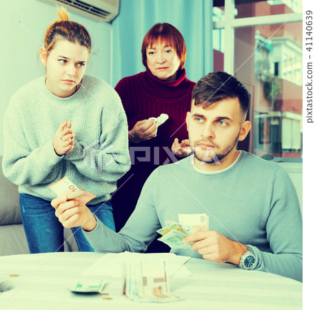 Woman asking husband for money 41140639