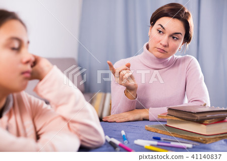 Mother seriously talks to daughter Mother seriously talks to daughter 41140837