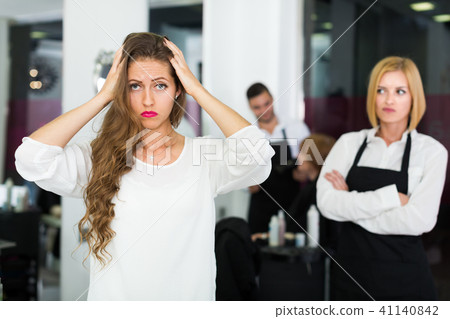 Woman client dissatisfied haircut 41140842