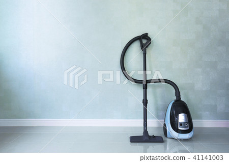 Vacuum cleaner on white concrete background. 41141003