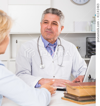 Professor of medicine training colleague 41141463
