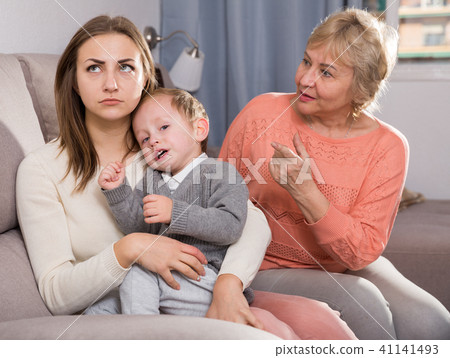 Two women are quarreling for upbringing toddler Two women are quarreling for upbringing toddler 41141493