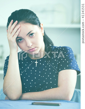 Woman waiting for phone call Woman waiting for phone call 41141531