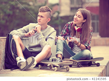 Teenage friends making things up after quarrel 41141595