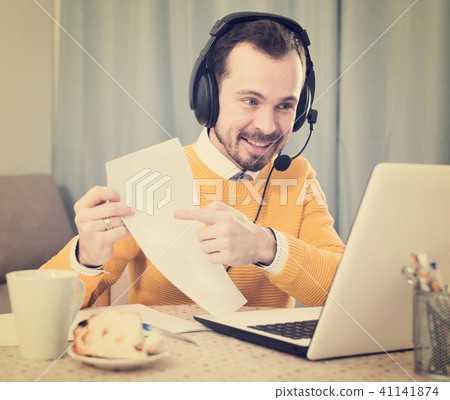 Man studying remotely at home Man studying remotely at home 41141874