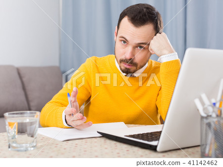 Man preparing for exams Man preparing for exams 41142462