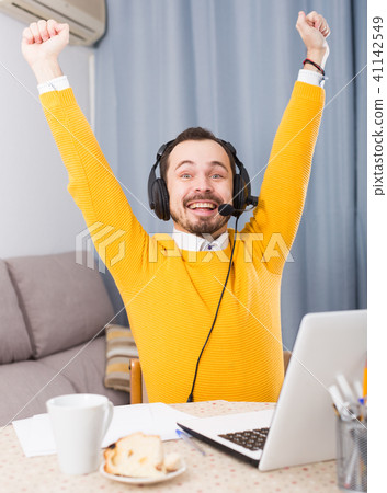 Man studying remotely at home Man studying remotely at home 41142549
