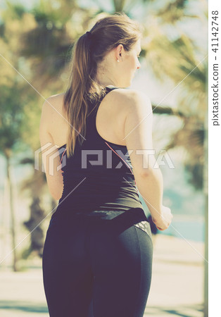 Woman jogging during outdoor workout 41142748