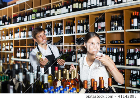 Woman trying glass of wine 41142895