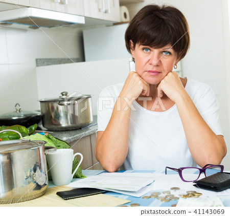 stressful woman paying bills 41143069
