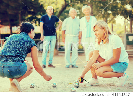 Happy family playing petanque in outdoor Happy family playing petanque in outdoor 41143207