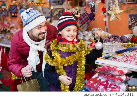 Father is buying X-mas presents Father is buying X-mas presents 41143311