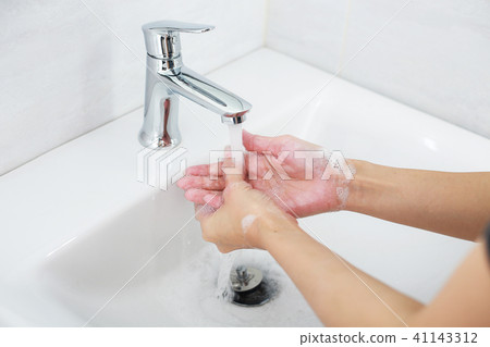 Washing hands with soap with clean water. Washing hands with soap with clean water. 41143312
