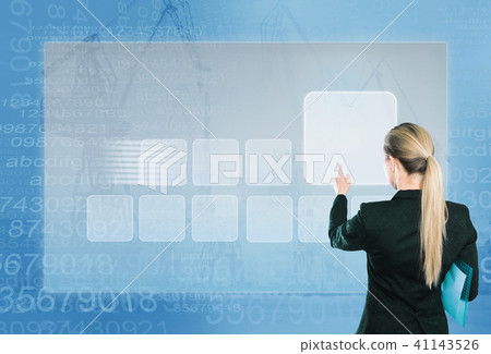 Businesswoman pressing virtual touchscreen 41143526