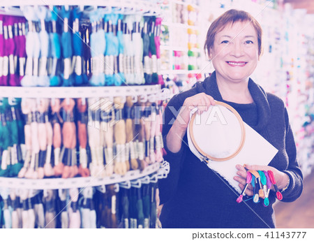 Woman buying embroidery accessories Woman buying embroidery accessories 41143777