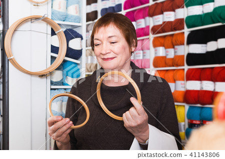 Senior female choosing embroidery hoops Senior female choosing embroidery hoops 41143806