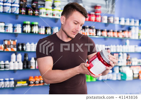 man choosing sport nutrition 41143816