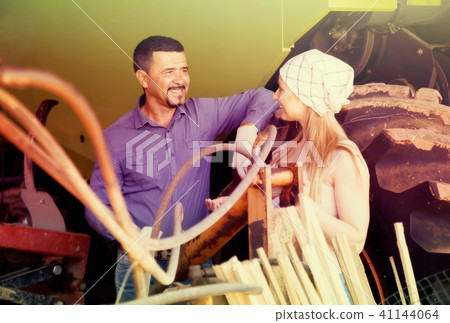 Two farmers near tractor. Two farmers near tractor. 41144064