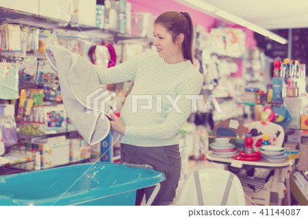 woman is choosing baby towel woman is choosing baby towel 41144087