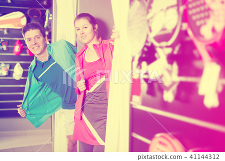 Tennis couple is standing in modern tennis wear Tennis couple is standing in modern tennis wear 41144312