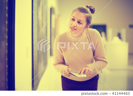 Woman at exhibition in museum 41144483