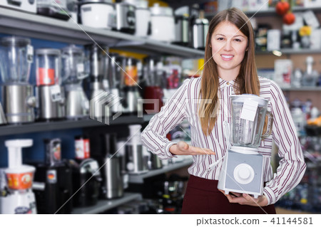 saleswoman offering blender saleswoman offering blender 41144581