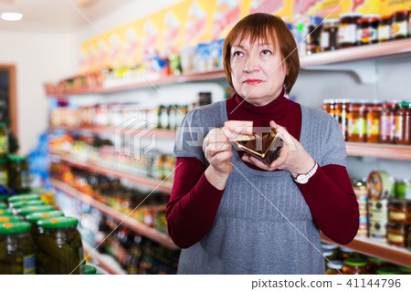 customer with wallet counting money in supermarket customer with wallet counting money in supermarket 41144796