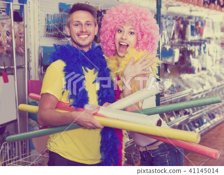 Young couple with firecrackers in hands is grimacing on camera 41145014
