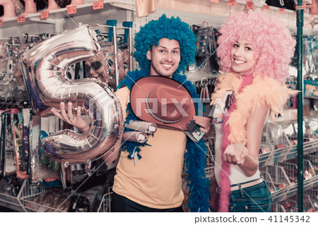 Family couple preparing for fest and choosing clown wigs 41145342