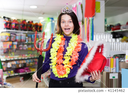 cheerful girl showing festival things in store 41145462