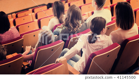 Teenage girl turning around from screen Teenage girl turning around from screen 41145500
